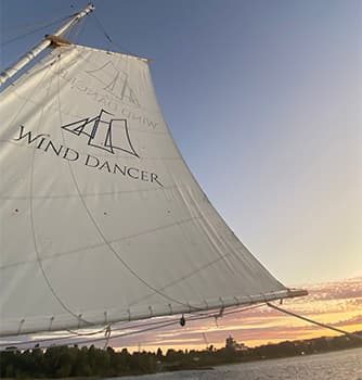 A sailboat with 'Wind Dancer' on the sail