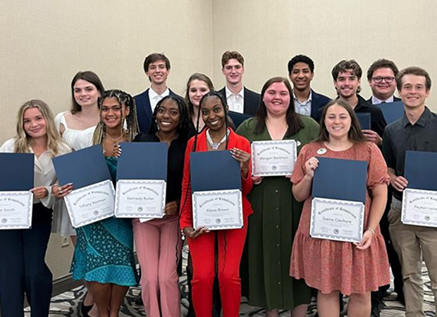 Group of interns with their certificate.