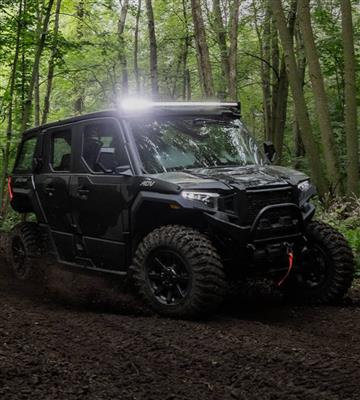 Polaris UTV on a mud trail